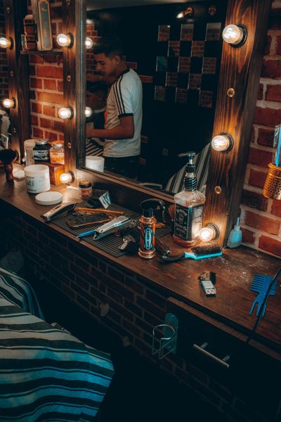 Barber shop bench with many hairdresser tools sitting on it