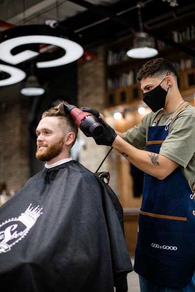 Person sitting getting a haircut